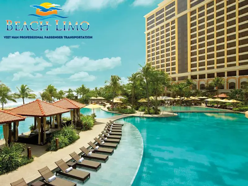 Resort swimming pool, hotel tower and palm trees with Beach Limo branding